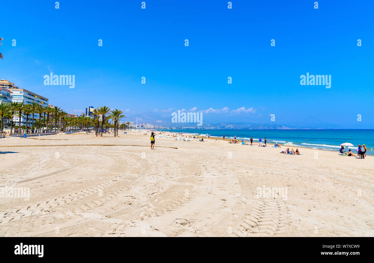 View on beach playa de san juan with blue sky, clouds, mountains by Alicante. Spain. Stock Photo