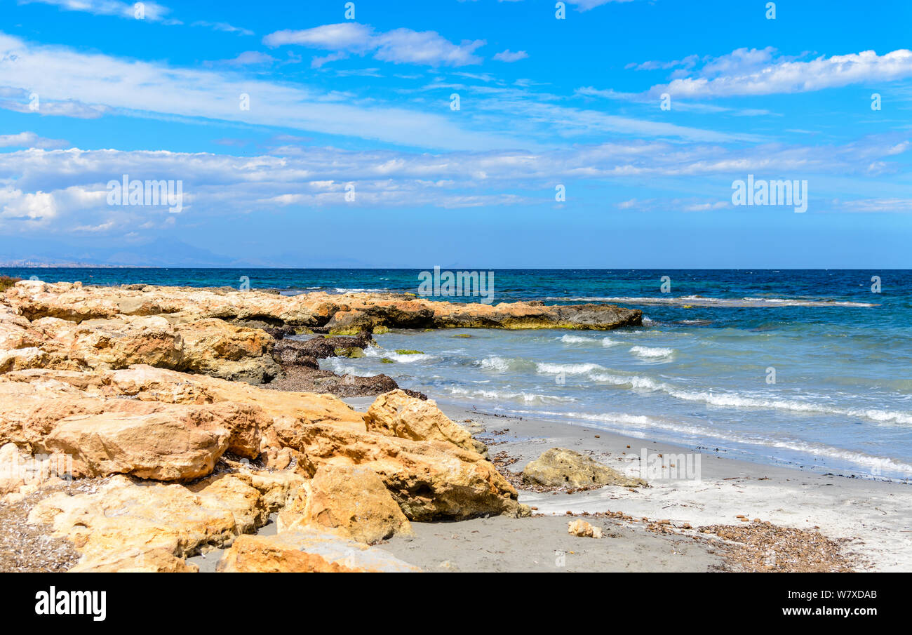 View on the mediterranean sea, shore near Alicante with clouds, blue sky. Spain. Stock Photo