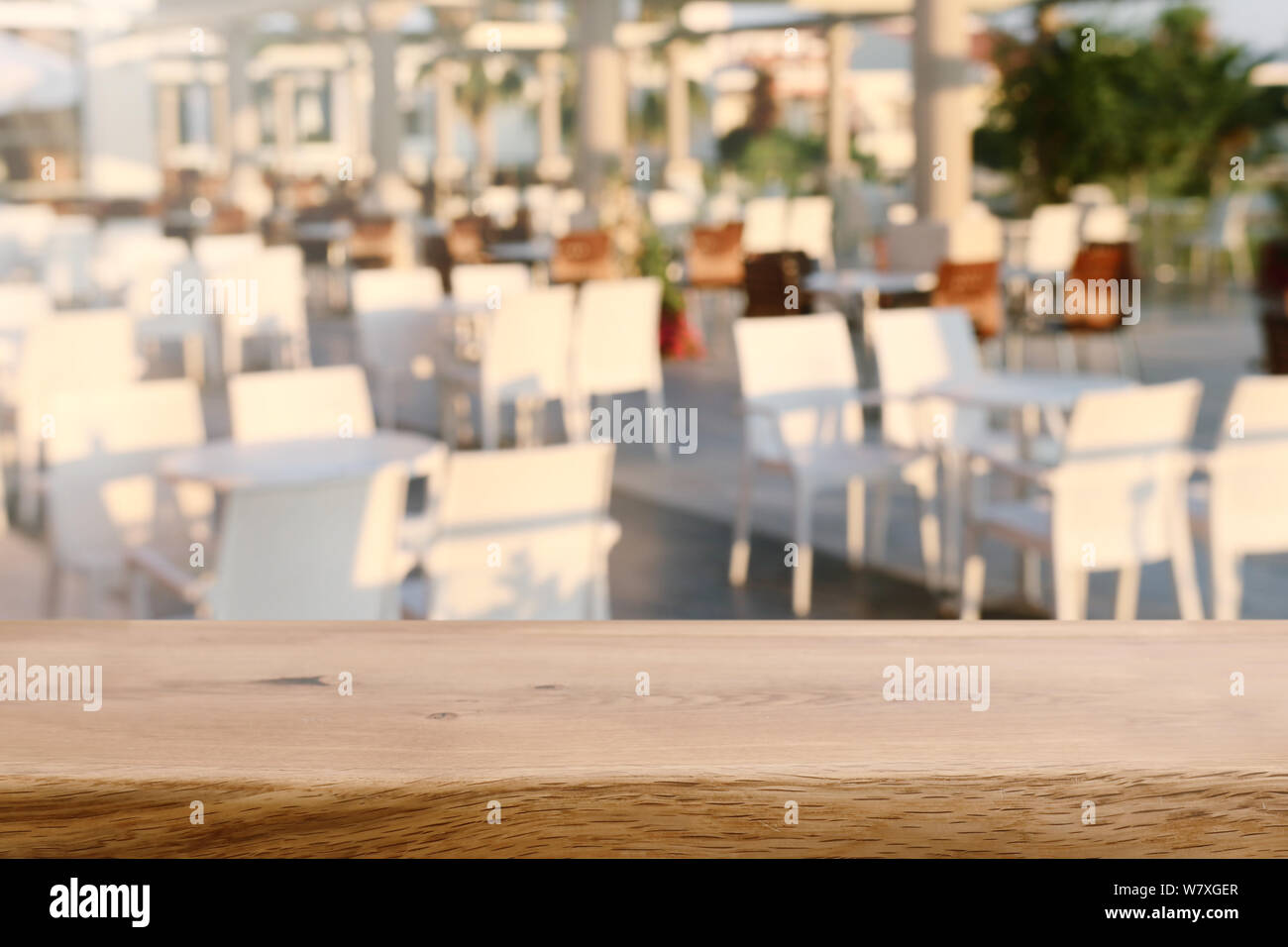 background Image of wooden table in front of blurred restaurant Stock ...
