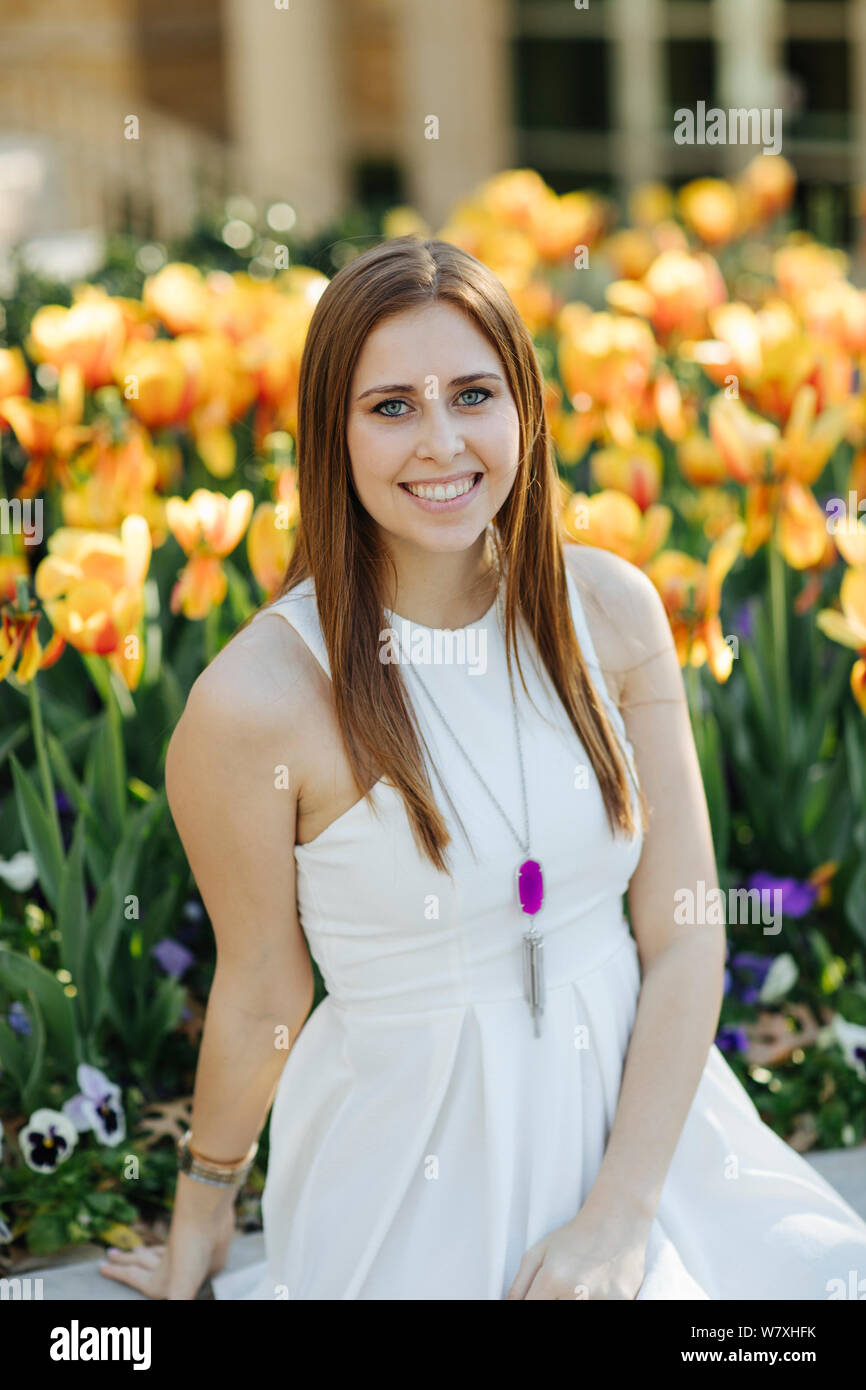 Woman in white dress sitting hi-res stock photography and images - Alamy