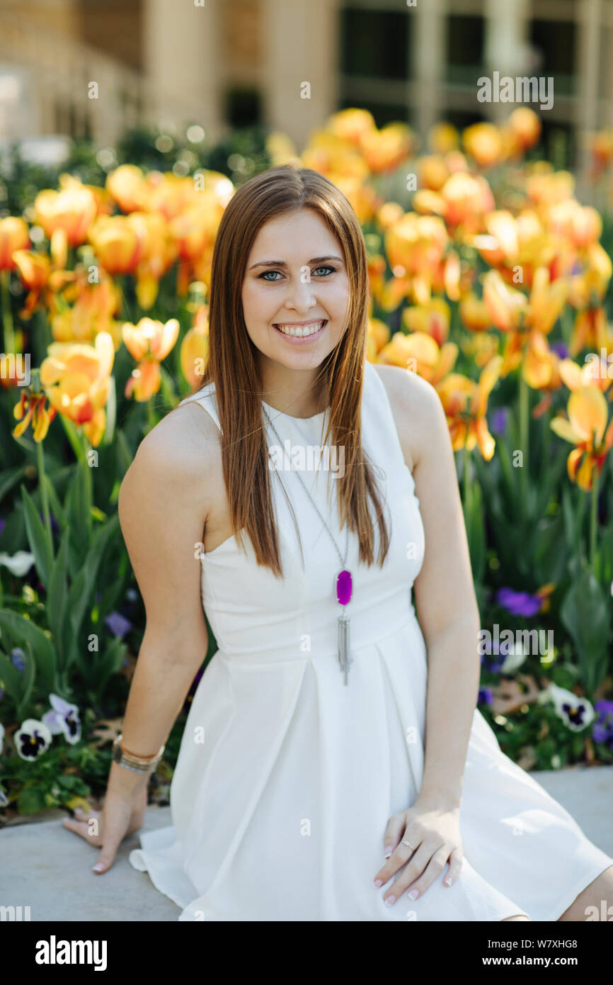 Woman in white dress sitting hi-res stock photography and images - Alamy