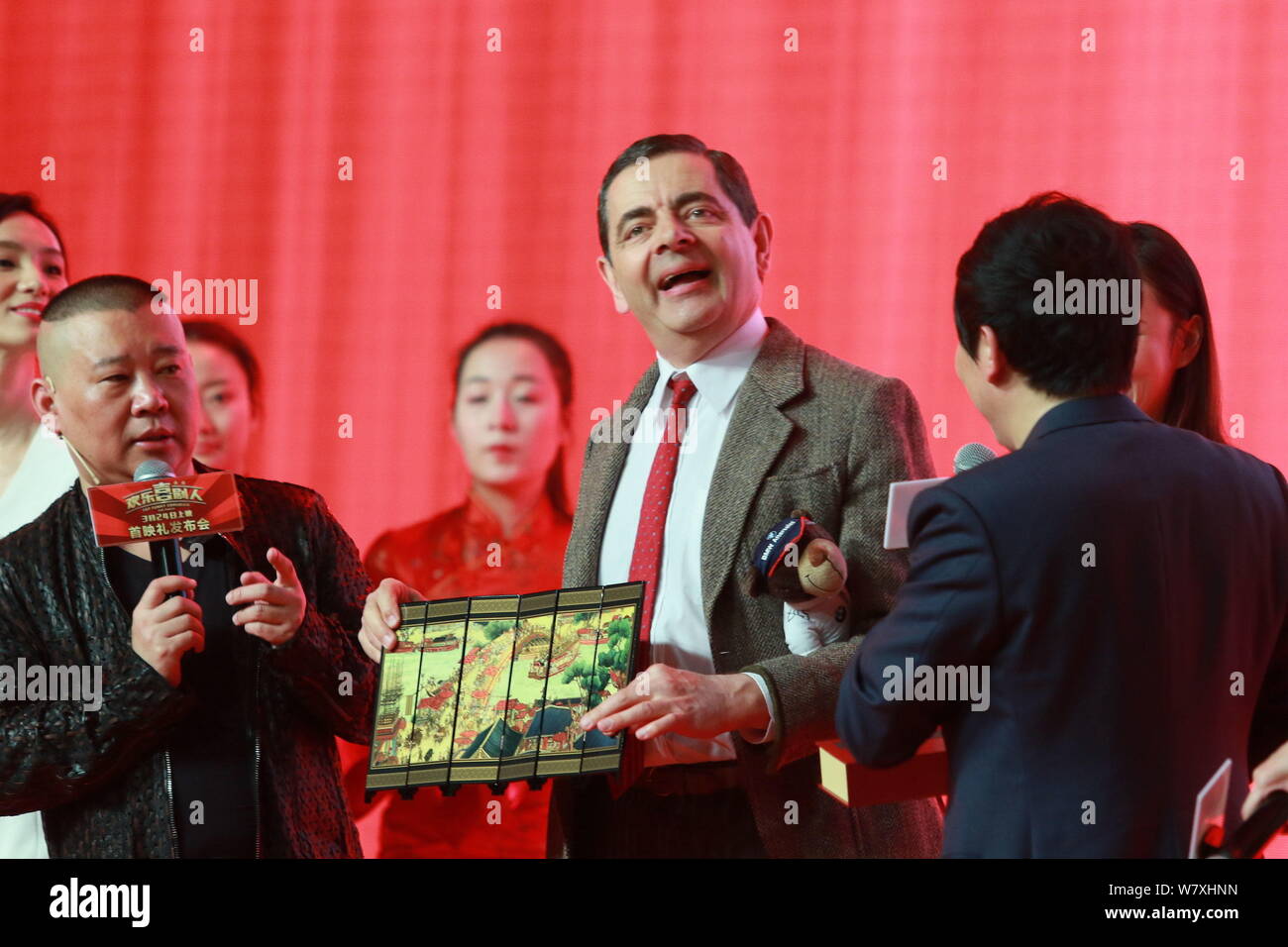 English actor Rowan Atkinson, center, plays Mr. Bean during a premiere for  his movie 