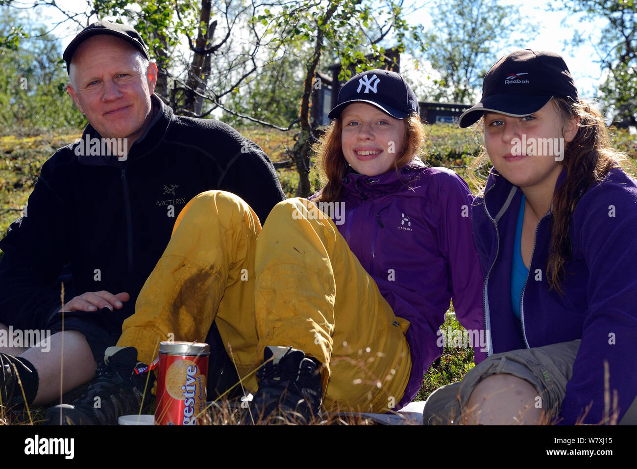 Photographer Staffan Widstrand with Mimmi Widstrand and Julia Mangsaker, opn family hiking trip,  Laponia Circuit, along the Padjelantaleden trail, Padjelanta National Park and Sarek National Park, Norrbotten, Lapland, Sweden. Model released Stock Photo