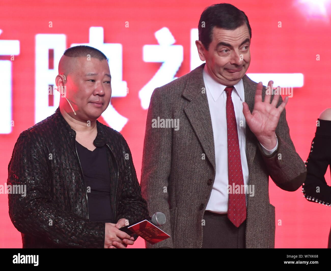 English actor Rowan Atkinson playing Mr. Bean, right, and Chinese comedian  Guo Degang attend a premiere for their movie 