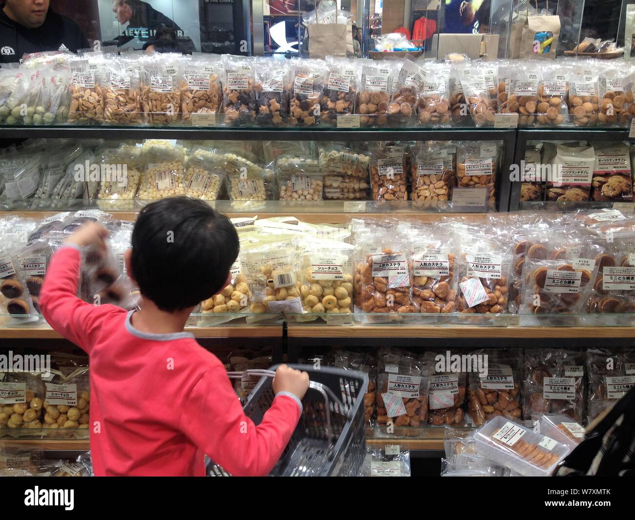 FILE--A Chinese boy shops for food and snacks at a a store of MUJI in Hong  Kong, China, 10 February 2017. NIKE China was accused of false promotio  Stock Photo - Alamy