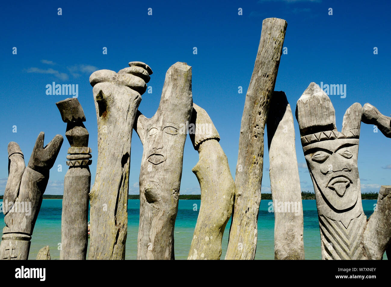 Wooden sculptures of faces, Ile des Pins (Pine Island), New Caledonia, September 2008. Stock Photo