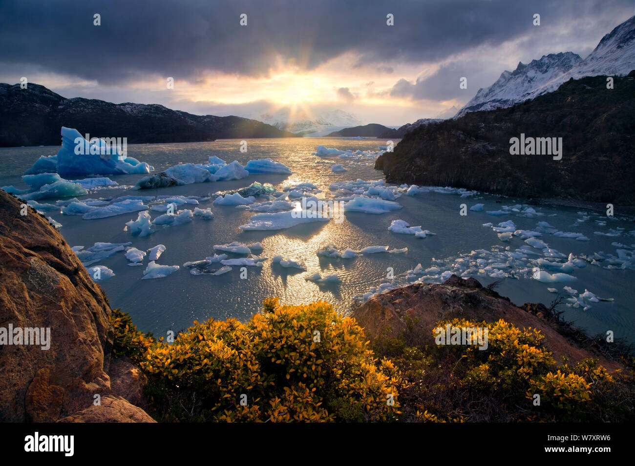 Sunset over the iceberg strewn Lago Grey, Torres del Paine National Park, Chile, June 2014. Stock Photo