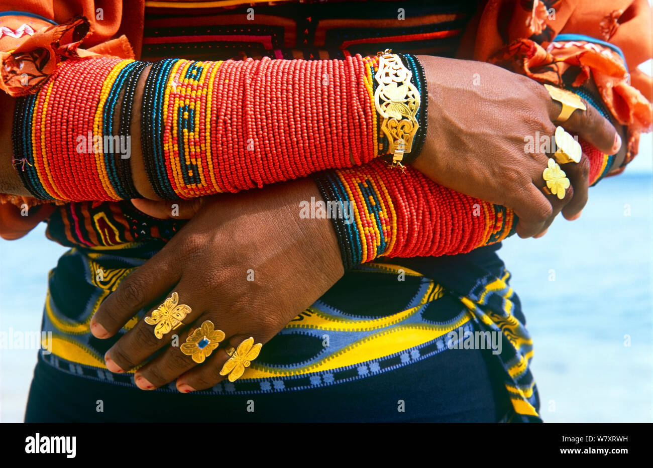 Close up of a Guna/Kuna Indian woman's traditional arm decorations and gold rings, San Blas Islands, Panama. Stock Photo