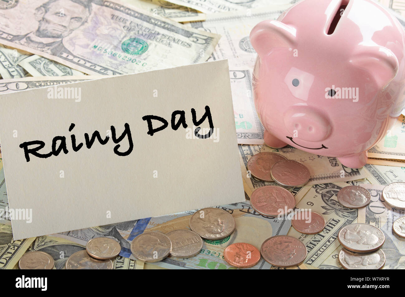 United States bank notes and coins with a calcultor, piggy bank, and a