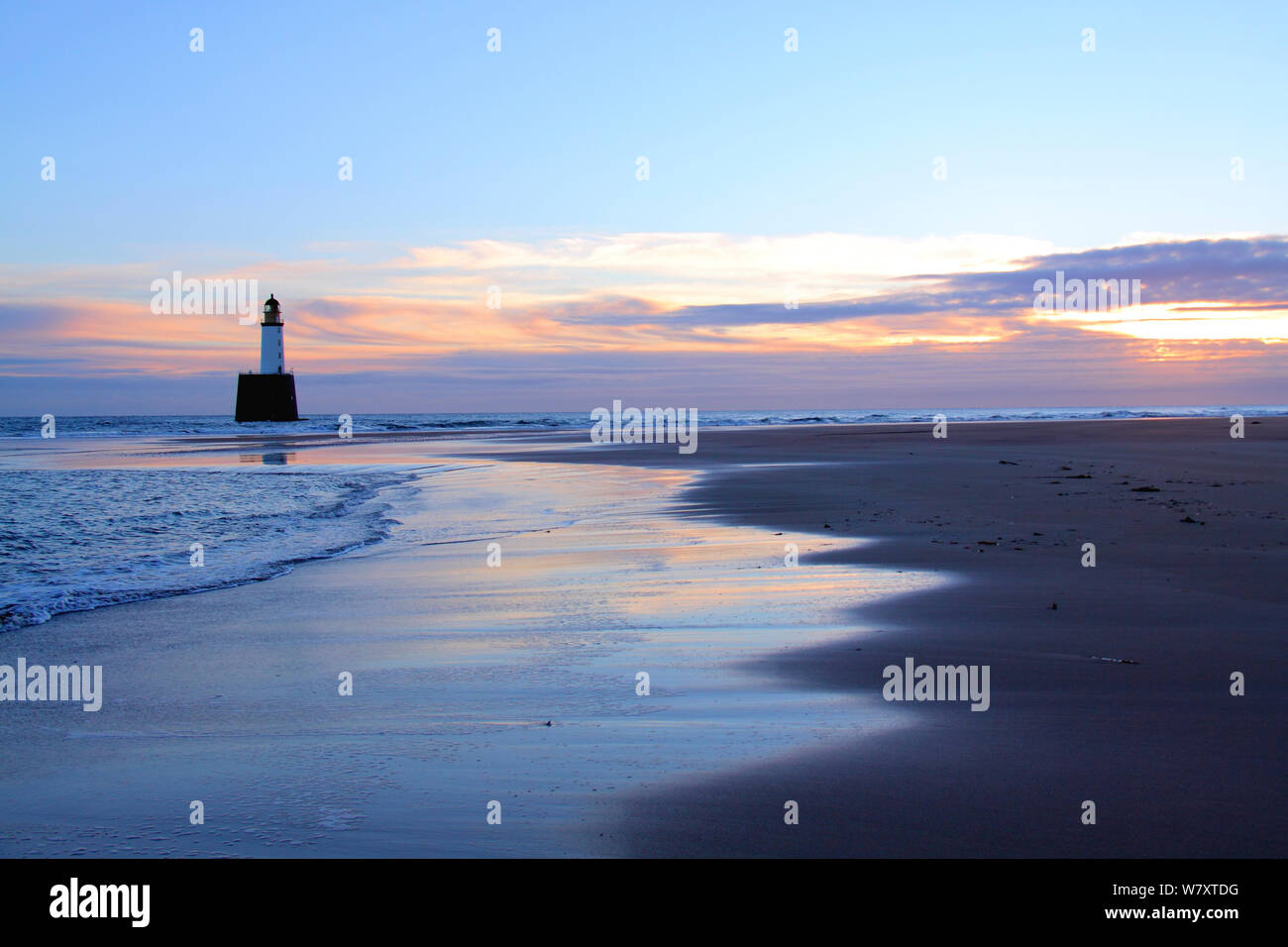 Sunrise at Rattray Head Lighthouse, north-east Scotland, January 2014. All non-editorial uses must be cleared individually. Stock Photo