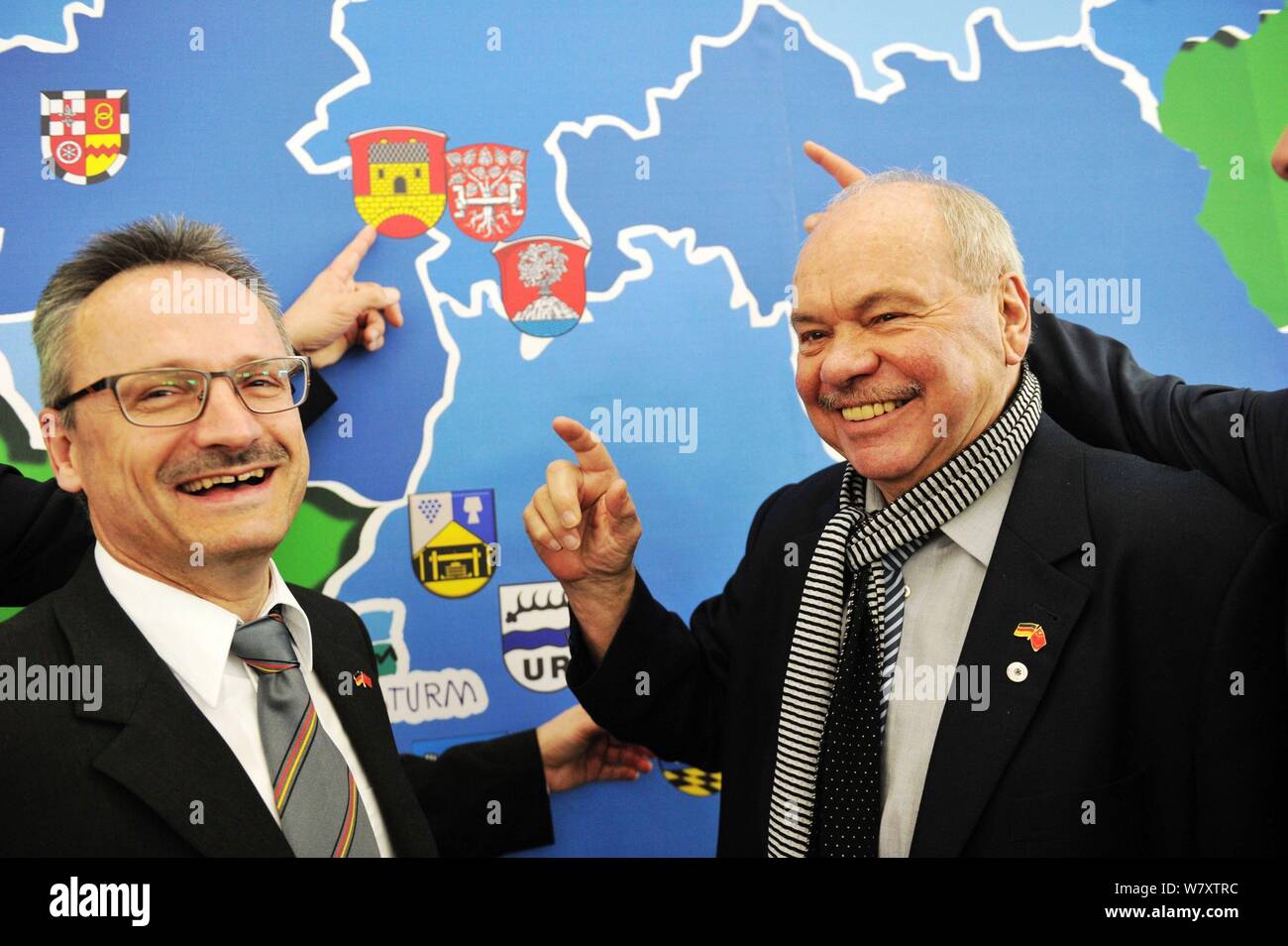 German football manager Klaus Schlappner, right, poses with a German city mayor during a symposium at the Sino-German Ecopark in Qingdao city, east Ch Stock Photo