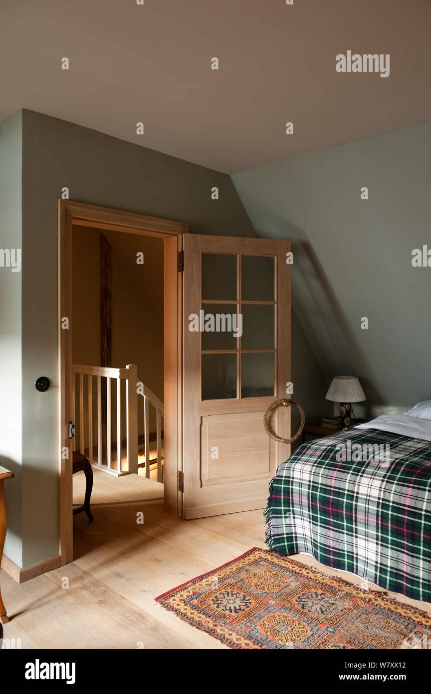 Open door of country style bedroom Stock Photo - Alamy