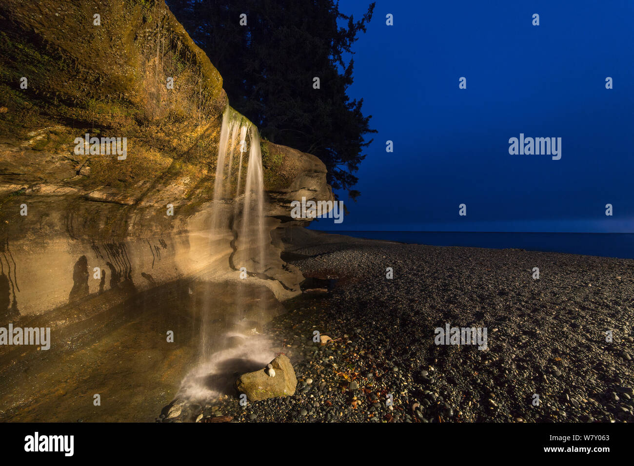 Sandcut Beach waterfall at dusk-Jordan River, British Columbia Canada Stock Photo