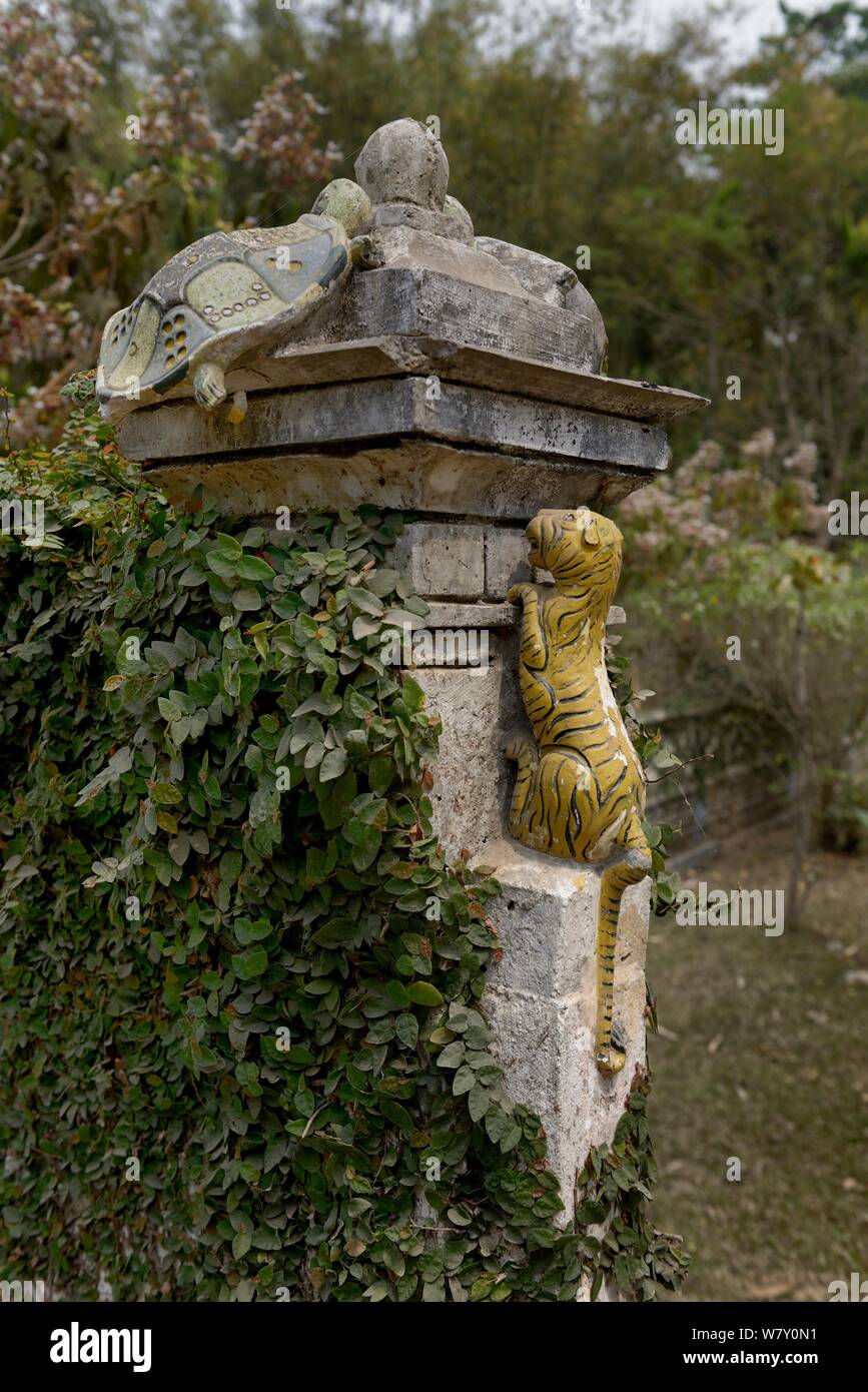 Decorative figures of a Tortoise and Tiger on gate post, Assam, India. Stock Photo