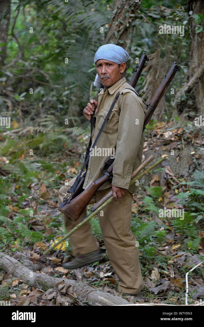 Portrait of armed ranger, Kaziranga National Park, Assam, India, March 2014. Stock Photo