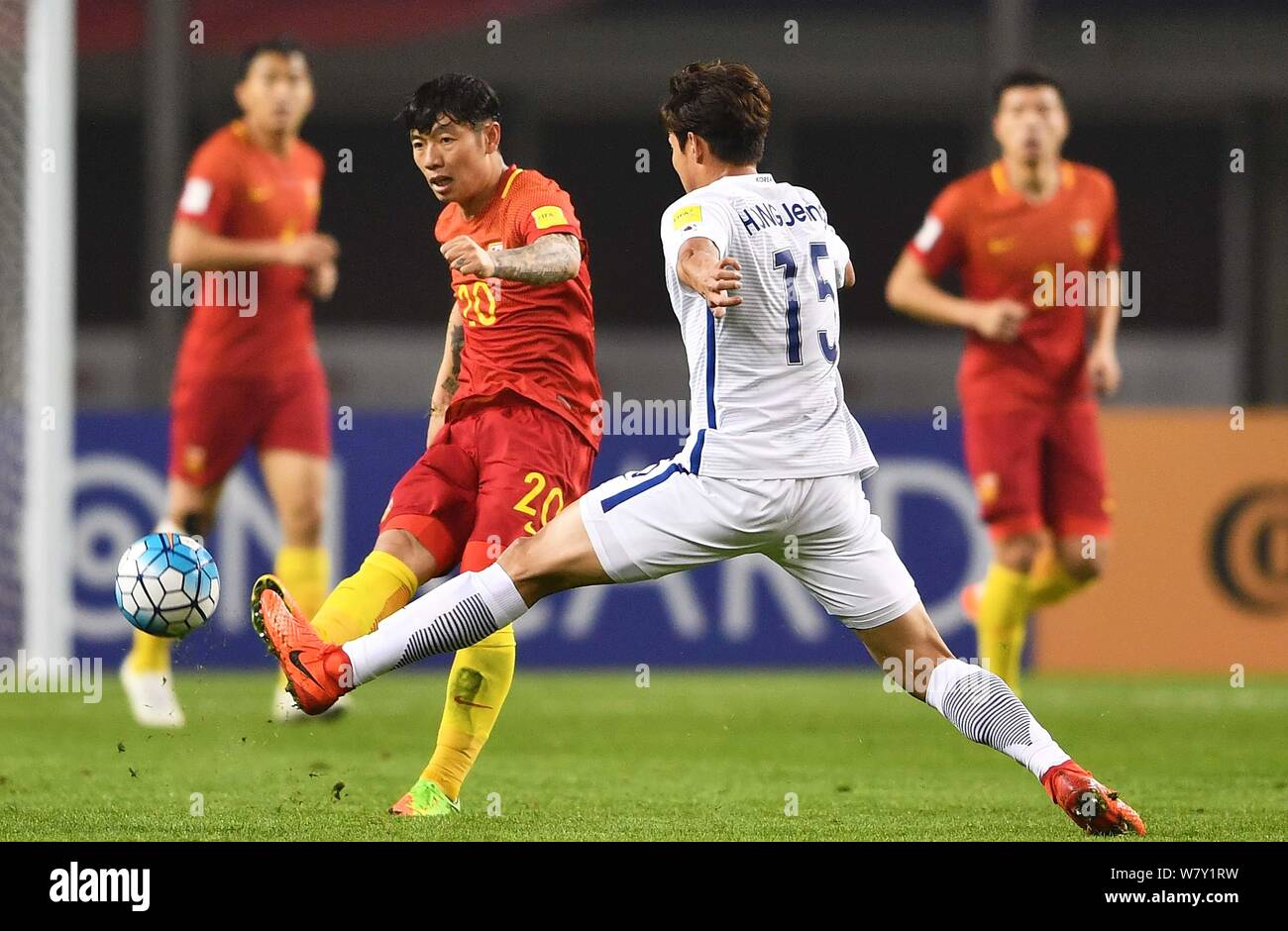 Hong Jeong-ho of South Korea national football team challenges Zhang Xizhe of Chinese national men's football team in their Group A Round 6 match duri Stock Photo