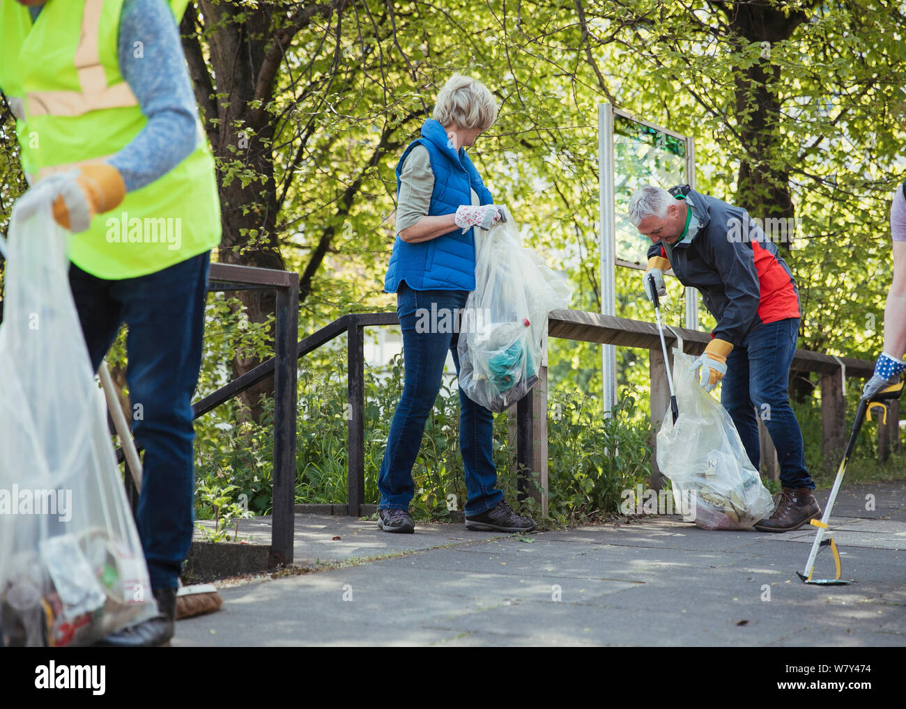 A group of people participating in a city clean-up together. Stock Photo