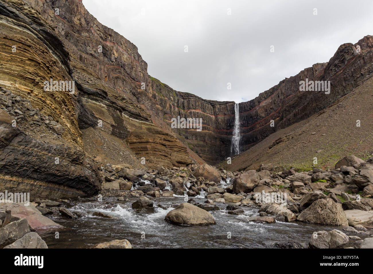 Hengifoss waterfall surrounded by basalt cliffs, Hengifoss, East Iceland, Iceland. August. Stock Photo
