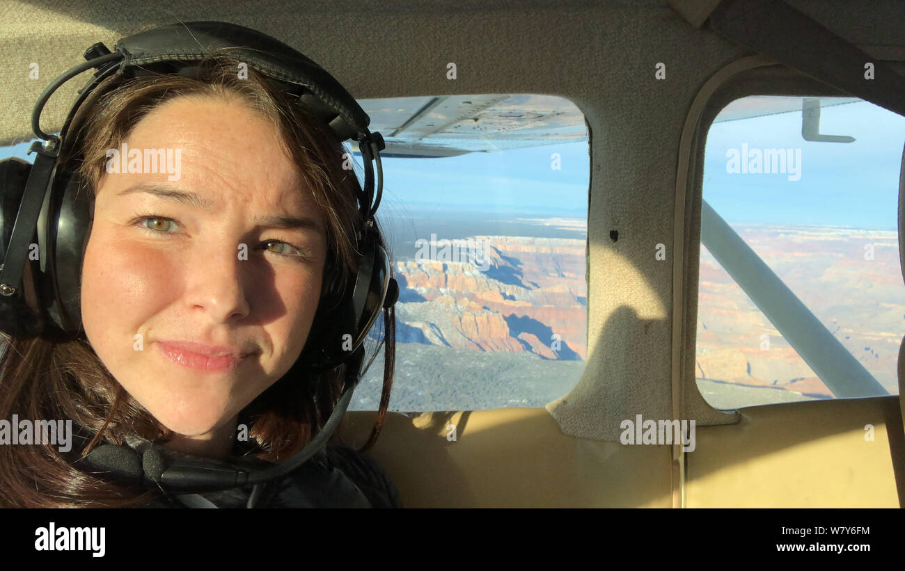 Female Flight Passenger Flying Over Grand Canyon National Park in Northern Arizona in the Southwestern United States of America Stock Photo