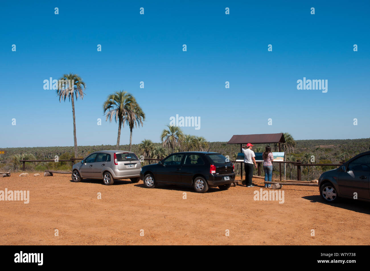 Tourists looking at information signs, El palmar National Park , Entre Rios Province, Argentina, August 2009. Stock Photo