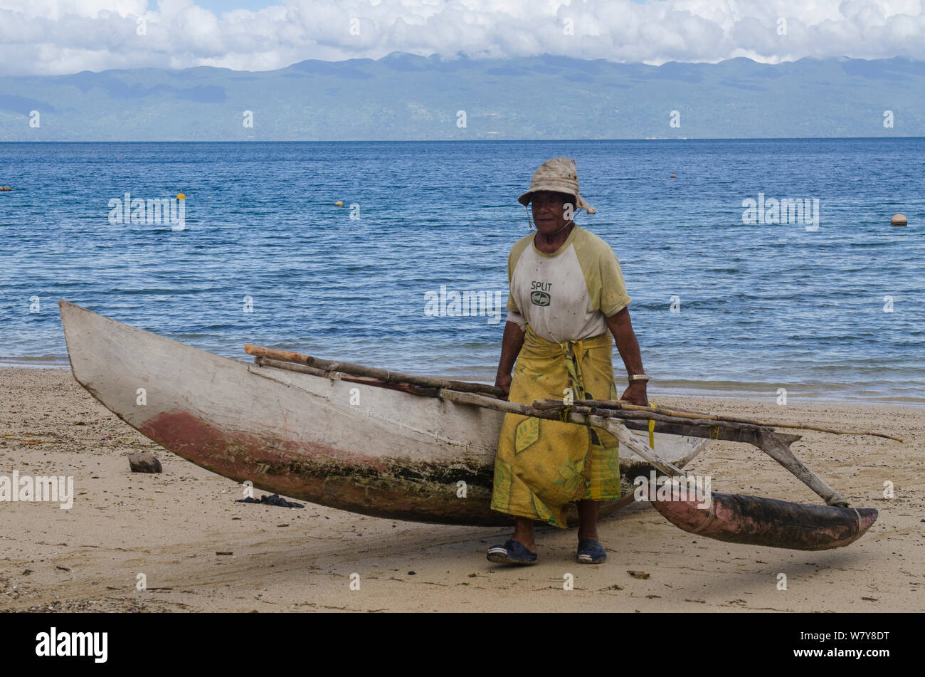 Fisherman with outrigger fishing canoe. Kioa Island, Fiji, South Pacific, July 2014. Stock Photo