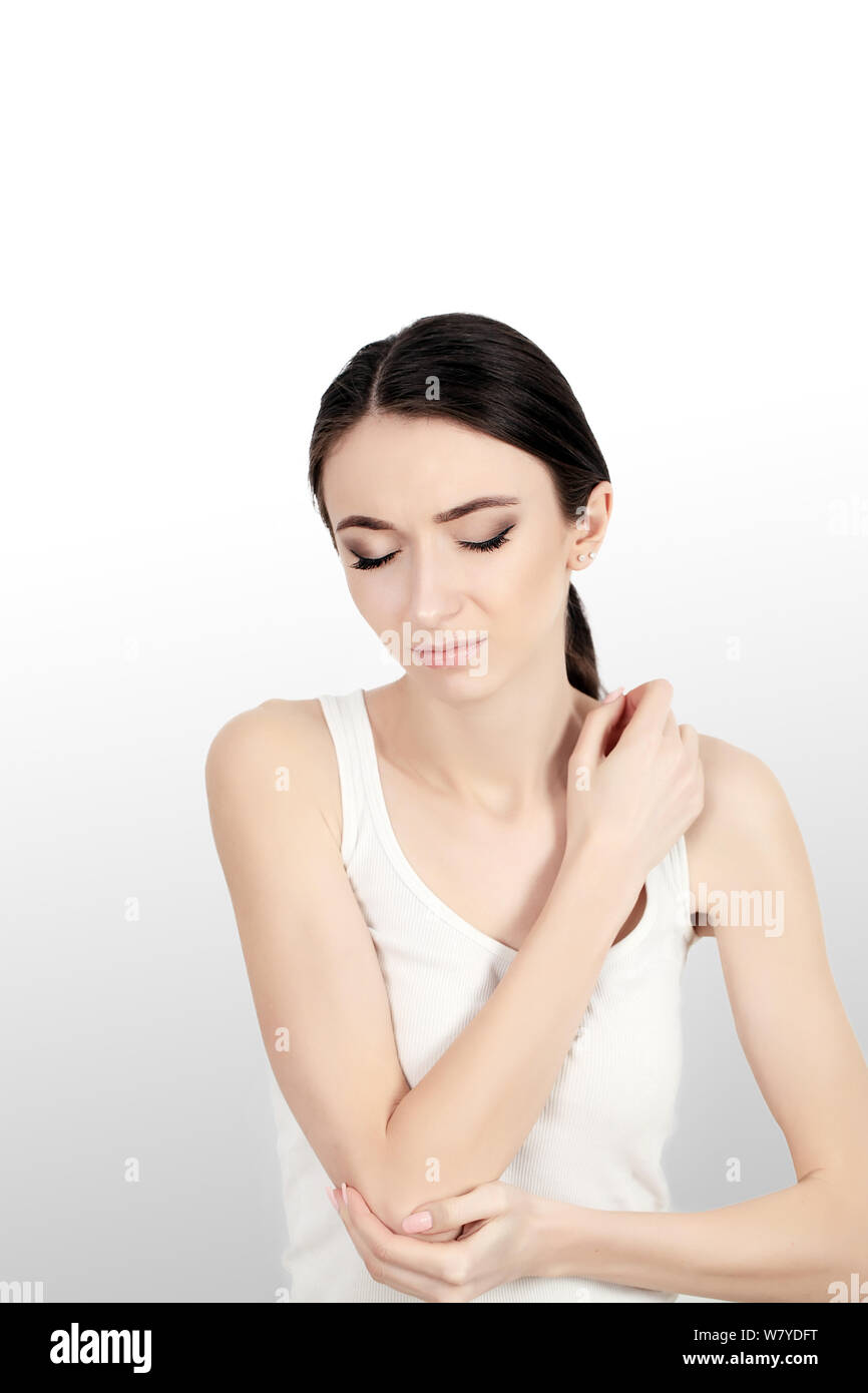Body Pain. Woman Feeling Sharp Pain In Elbows. Portrait Of Beautiful