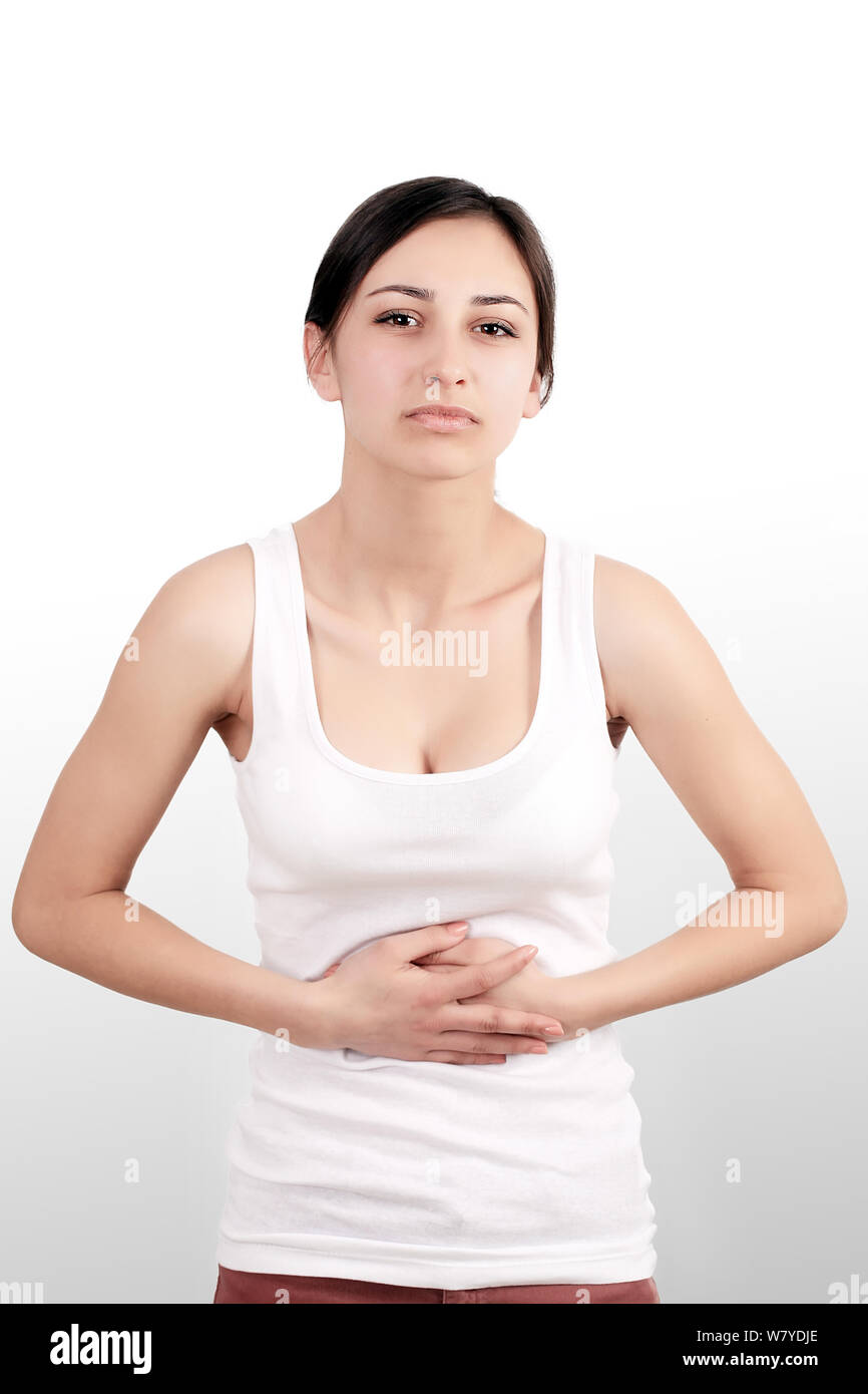 Health Issues. Beautiful Young Woman Feeling Strong Pain In Stomach