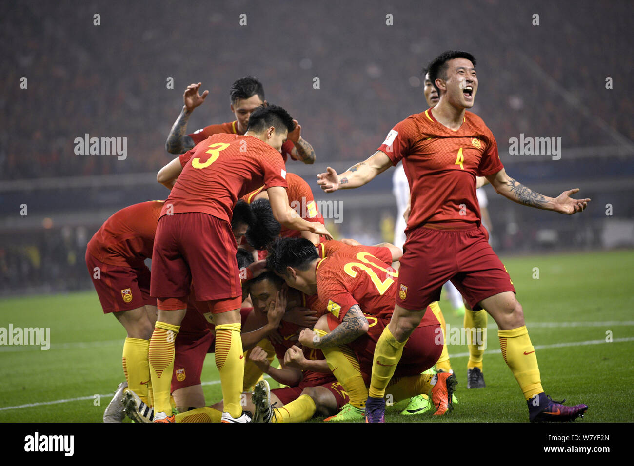 Players of Chinese national men's football team celebrate after scoring a goal against South Korea in their Group A Round 6 match during the FIFA Worl Stock Photo