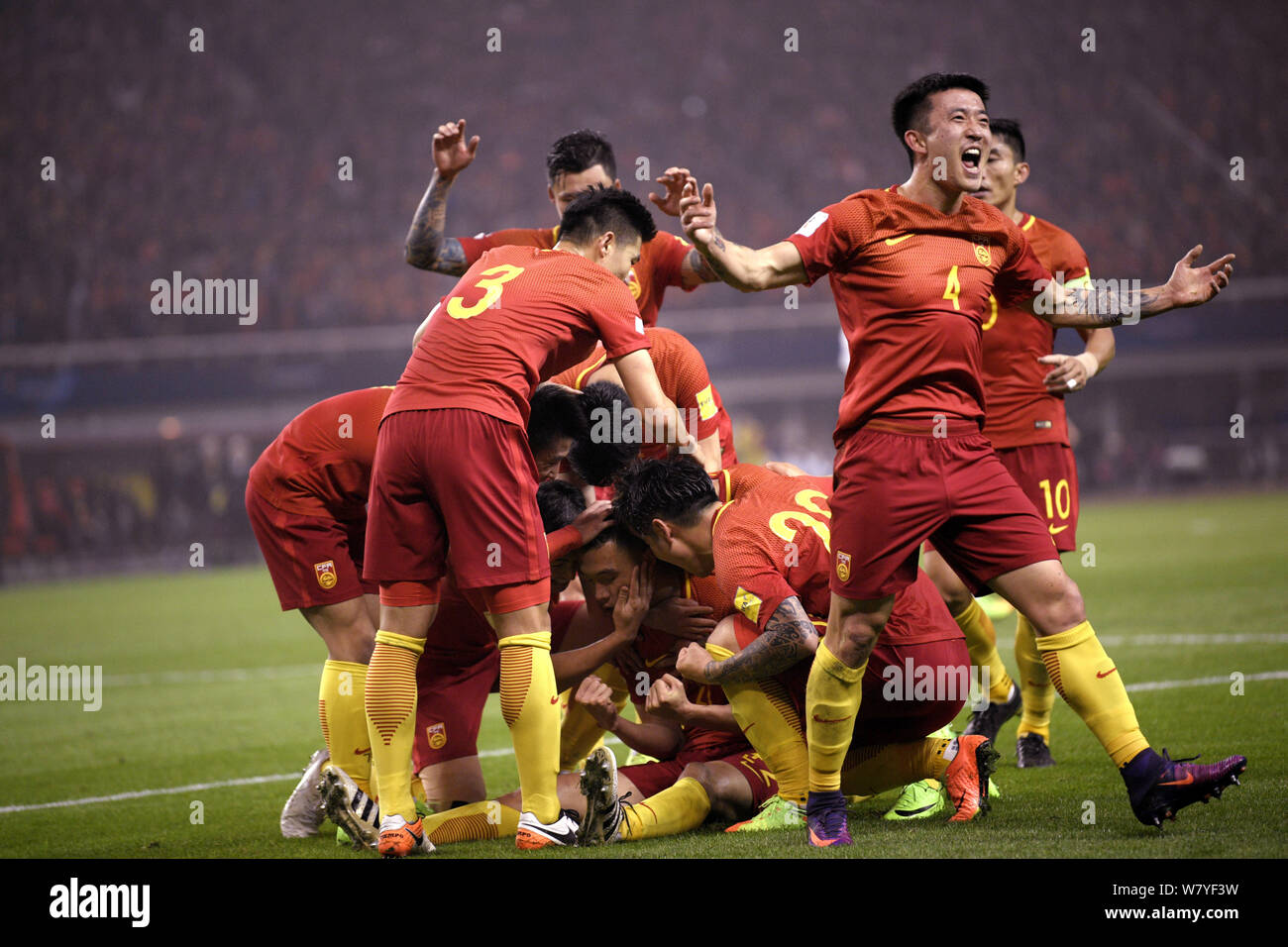 Players of Chinese national men's football team celebrate after scoring a goal against South Korea in their Group A Round 6 match during the FIFA Worl Stock Photo