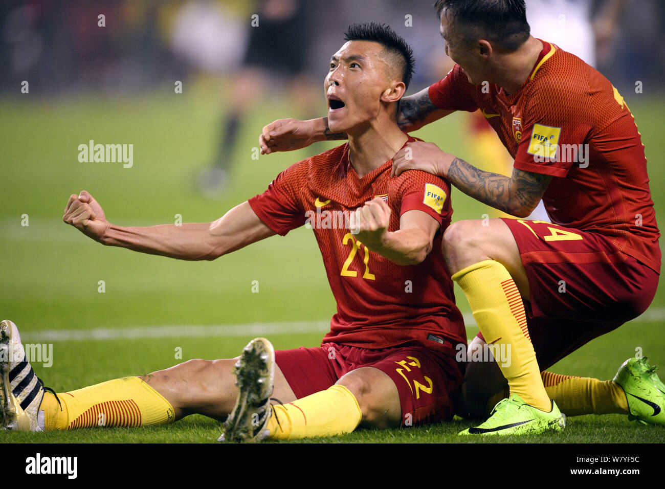 Yu Dabao, left, and Wang Yongpo of Chinese national men's football team celebrate after scoring a goal against South Korea in their Group A Round 6 ma Stock Photo