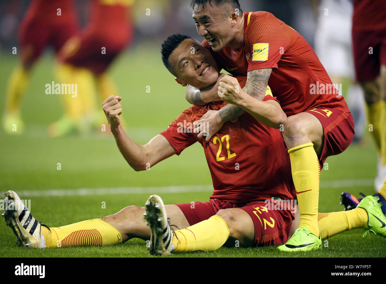 Yu Dabao, left, and Wang Yongpo of Chinese national men's football team celebrate after scoring a goal against South Korea in their Group A Round 6 ma Stock Photo