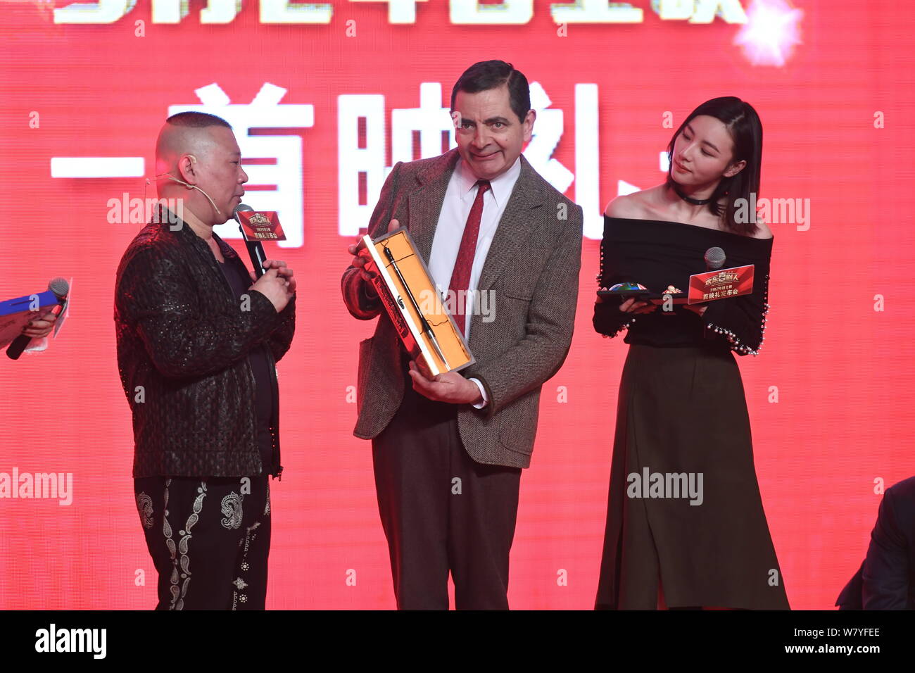 English actor Rowan Atkinson playing Mr. Bean, center, and Chinese comedian Guo Degang, left, attend a premiere for their movie English actor Rowan Atkinson playing Mr. Bean, center, and Chinese comedian Guo Degang, left, attend a premiere for their movie