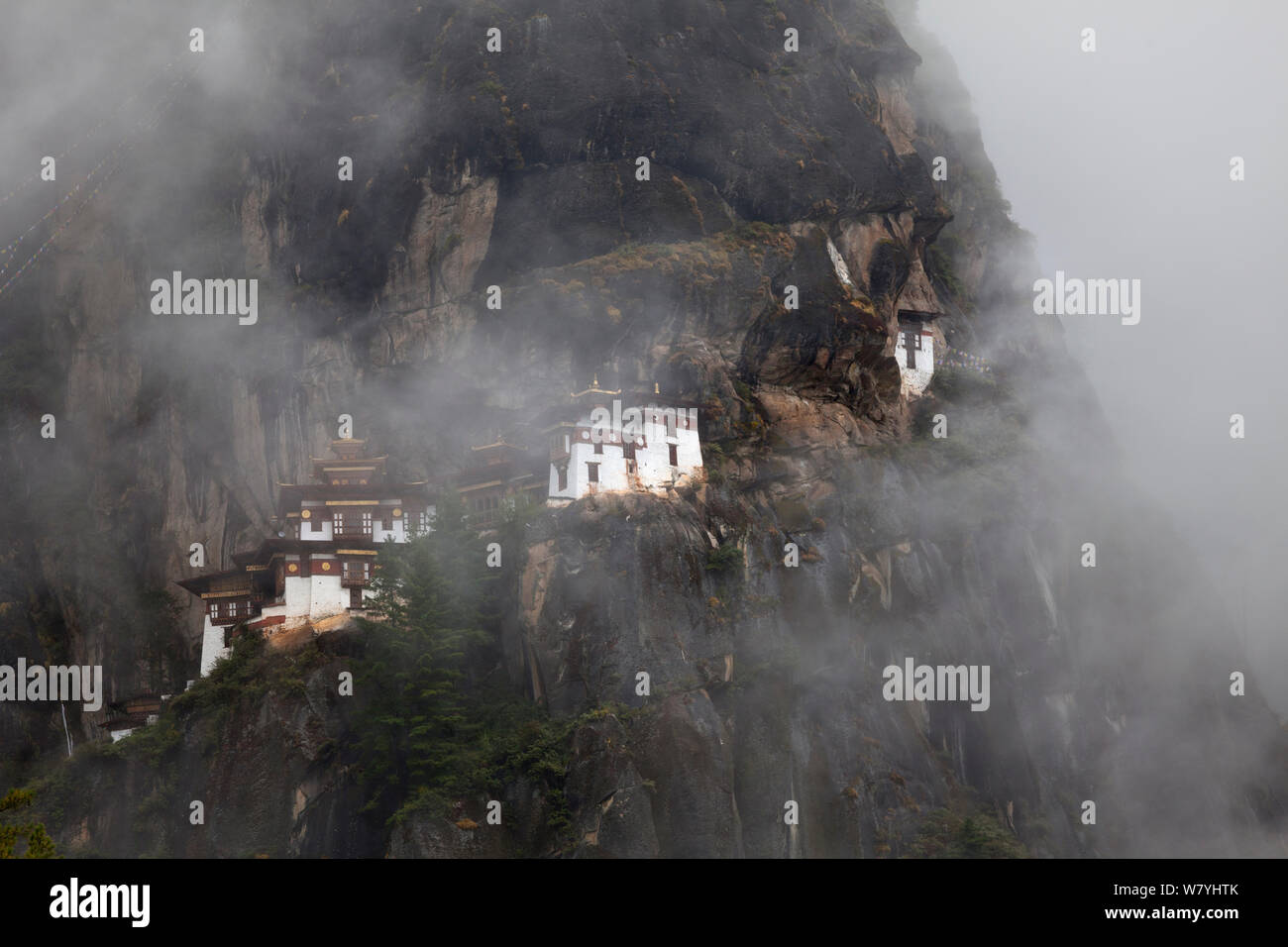 The Tiger&#39;s Nest Monastery on a rocky mountainside near the town of Paro. Bhutan, October 2014. Stock Photo