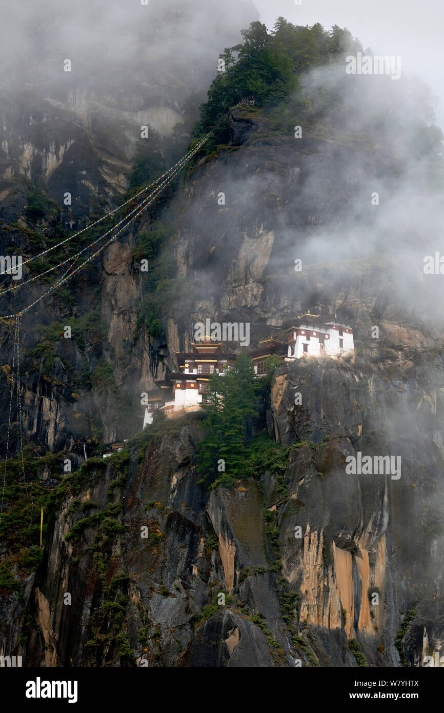 The Tiger&#39;s Nest Monastery on rocky mountainside near the town of Paro. Bhutan, October 2014. Stock Photo