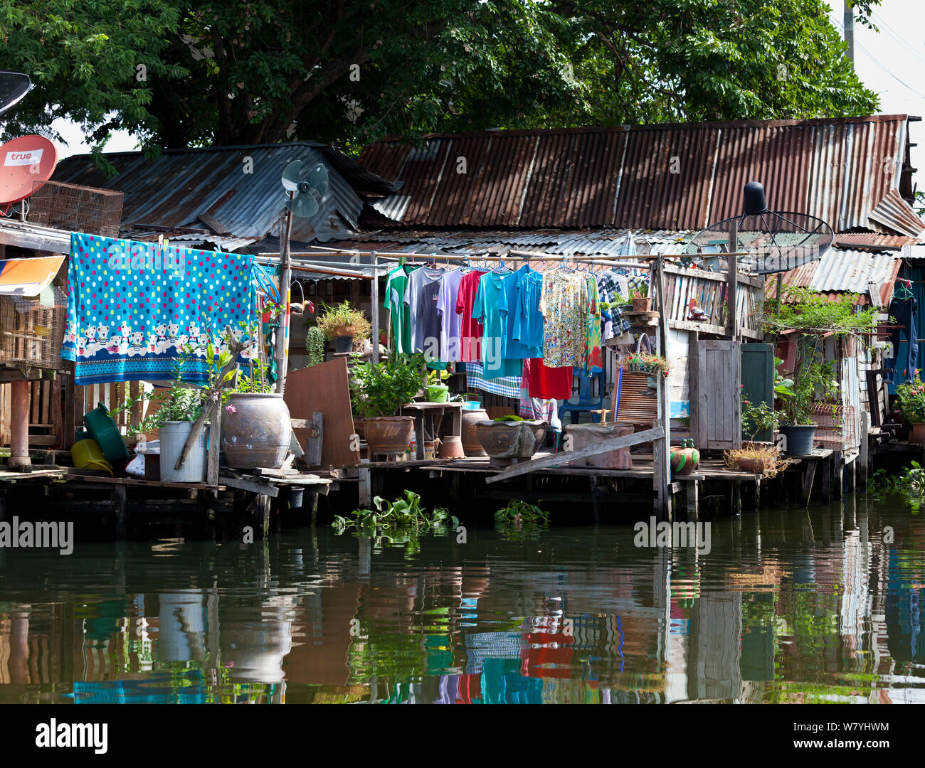 Laundry hanging to dry outside homes along the Khlong Bangkok Yai (canal), Bangkok. Thailand, September 2014. Stock Photo