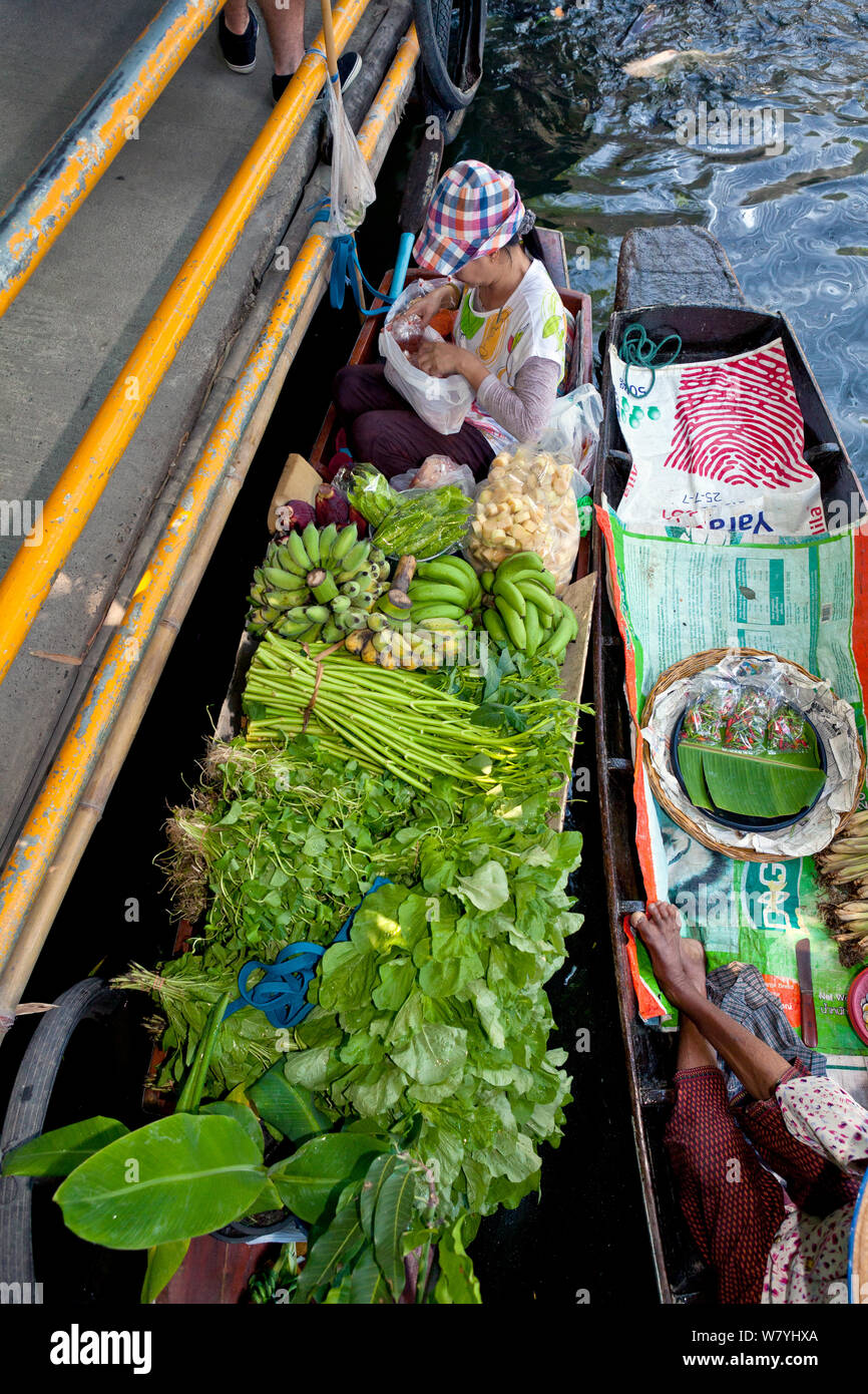 Boats loaded with fruit and vegetables to sell at the Ladmayom Floating Market near Bangkok, Thailand, September 2014. Stock Photo