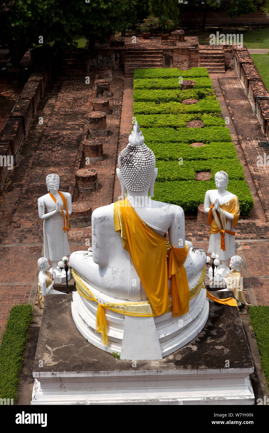 Buddhas with yellow sashes, at Wat Yai Chaya Mongkol, Ayutthaya. Thailand, September 2014. Stock Photo
