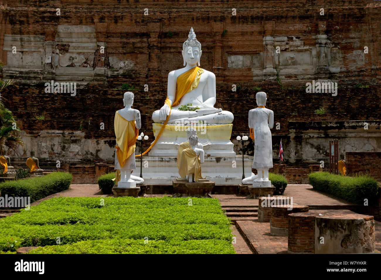 Statue of Buddha with yellow sash in (Calling the Earth to Witness posture) Wat Yai Chaya Mongkol, Ayutthaya. Thailand, September 2014. Stock Photo