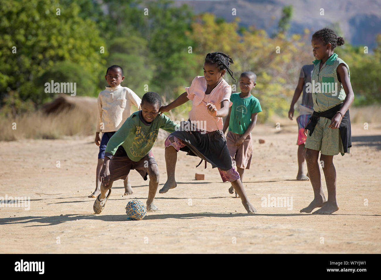 Girls and boys playing football, Anjaha Community Conservation Site, near Ambalvao, Madagascar. November 2014. Stock Photo