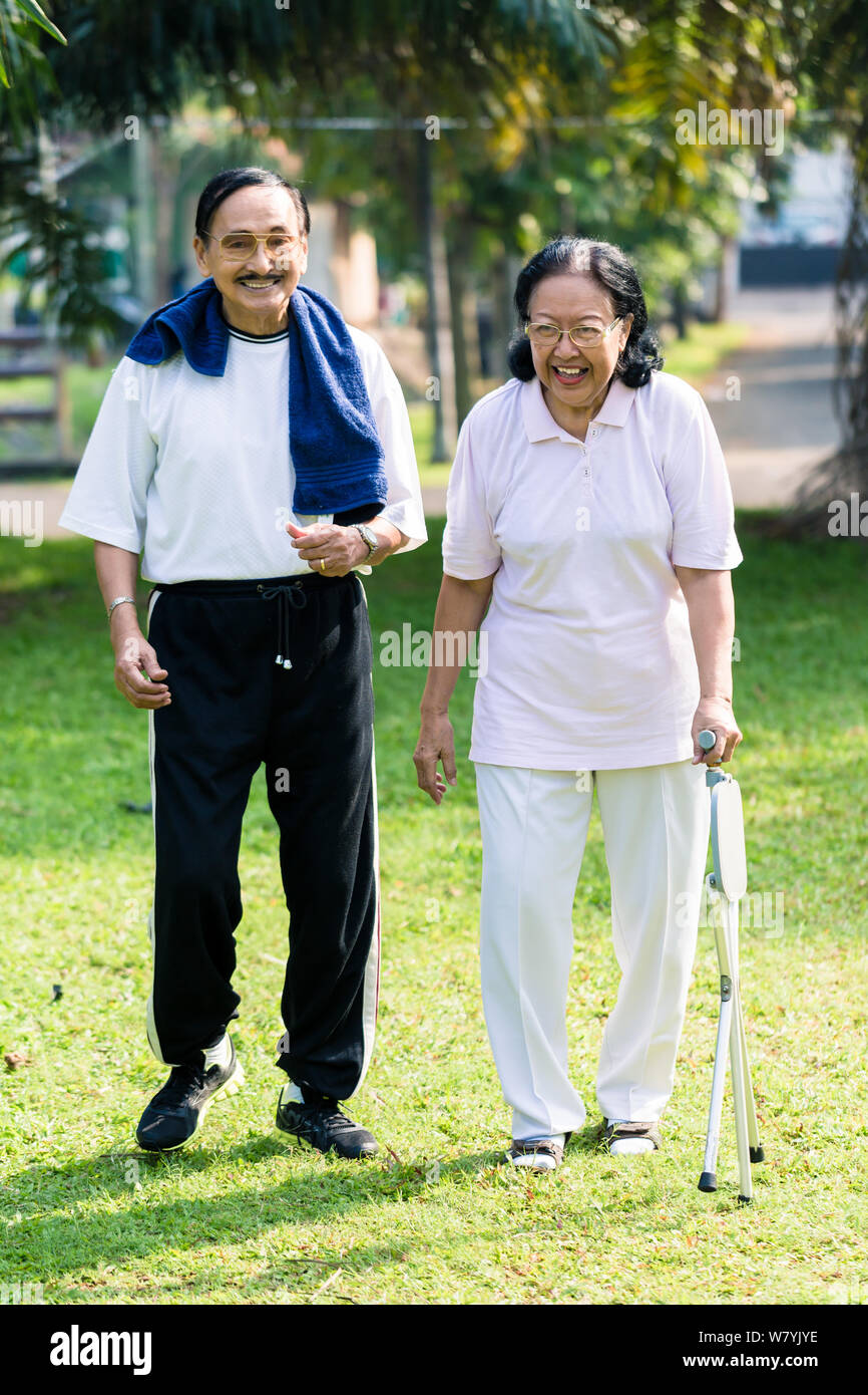 Man woman walking stick senior hi-res stock photography and images - Alamy