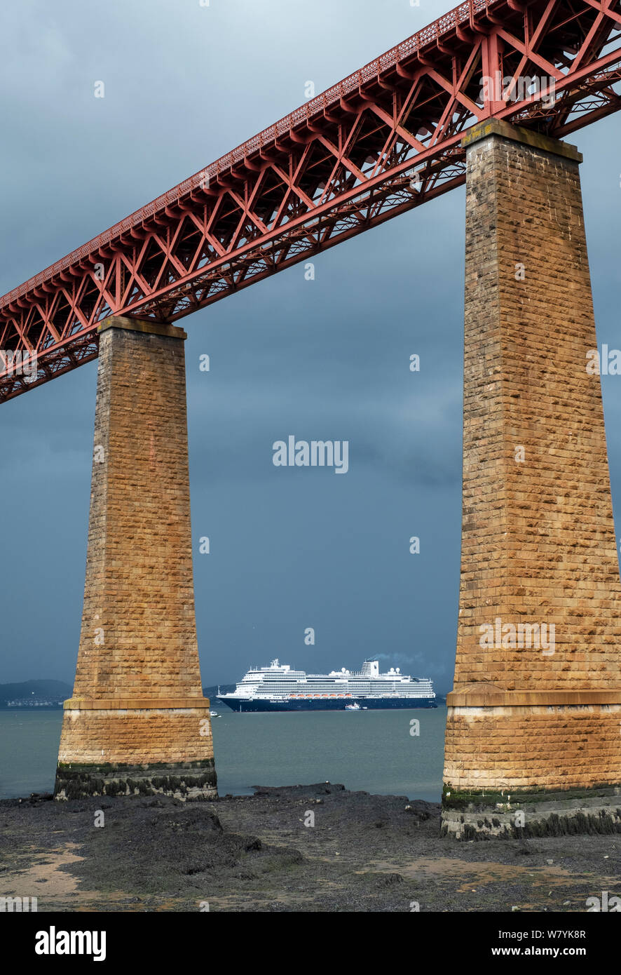 The Holland America Nieuw Statendam cruise liner berthed in the Firth of Forth at South Queensferry with the iconic Forth Rail Bridge in the foreground. Stock Photo