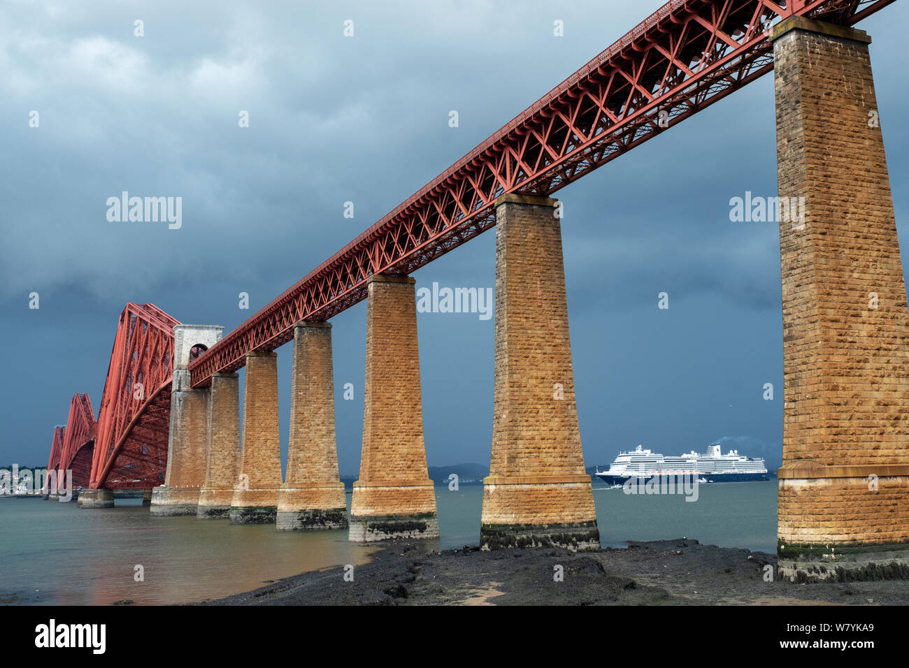 The Holland America Nieuw Statendam cruise liner berthed in the Firth of Forth at South Queensferry with the iconic Forth Rail Bridge in the foreground. Stock Photo