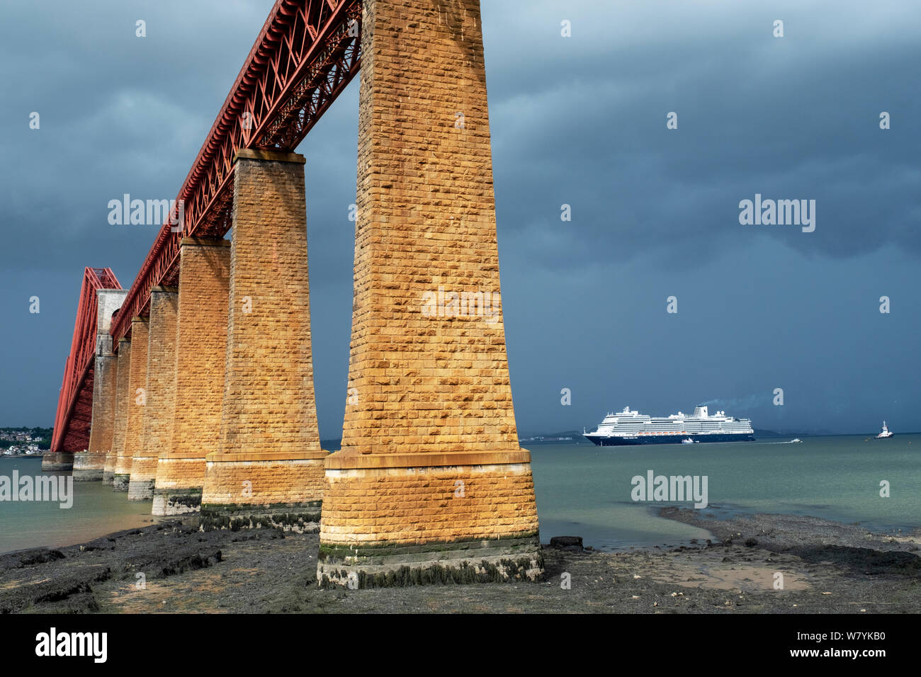 The Holland America Nieuw Statendam cruise liner berthed in the Firth of Forth at South Queensferry with the iconic Forth Rail Bridge in the foreground. Stock Photo