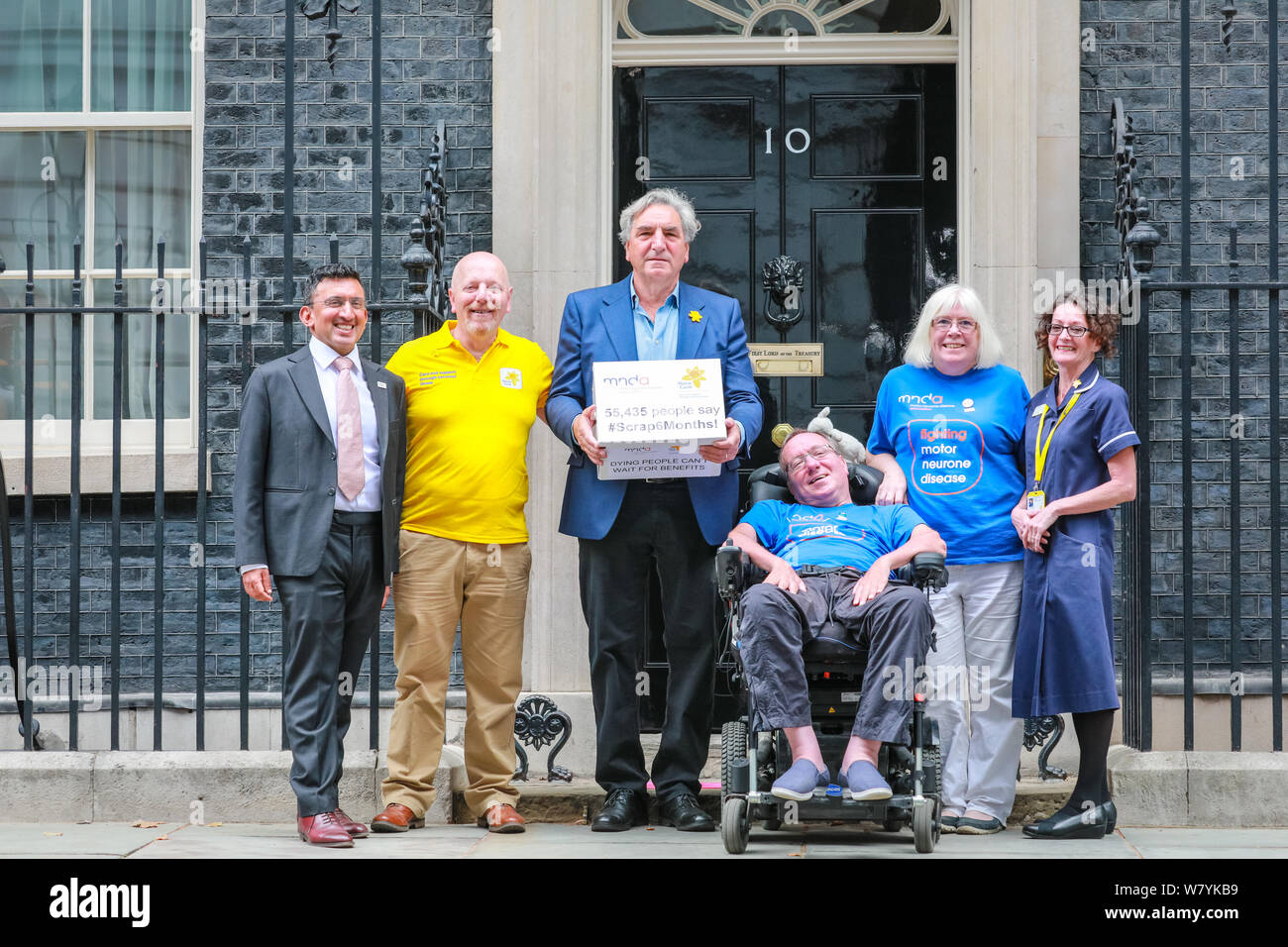 Downing Street, London, UK, 07th Aug 2019. Actor Jim Carter (Downton Abbey's Mr. Carson) hands in a petition at No 10 Downing Street, together with charity workers and carers. The petition, called 'Scrap 6 Months' on behalf of the Marie Curie and Motor Neurone Disease Association is for terminally ill patients to have faster access to fast track higher rate benefits. Credit: Imageplotter/Alamy Live News Stock Photo