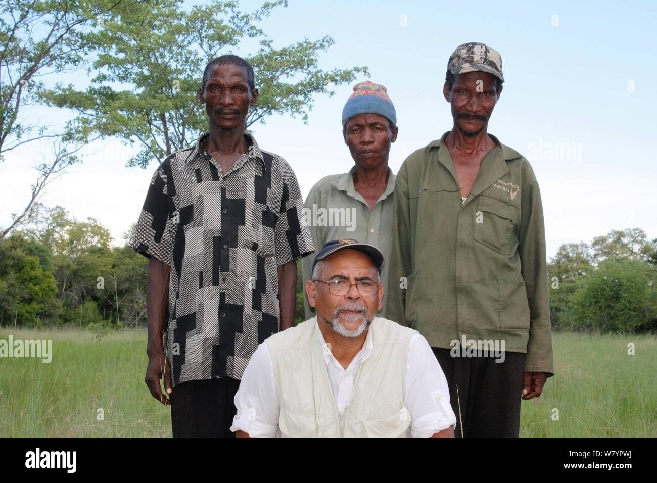 Photographer Steve O Taylor with park rangers, Bwabwata Conservancy, Namibia. Stock Photo