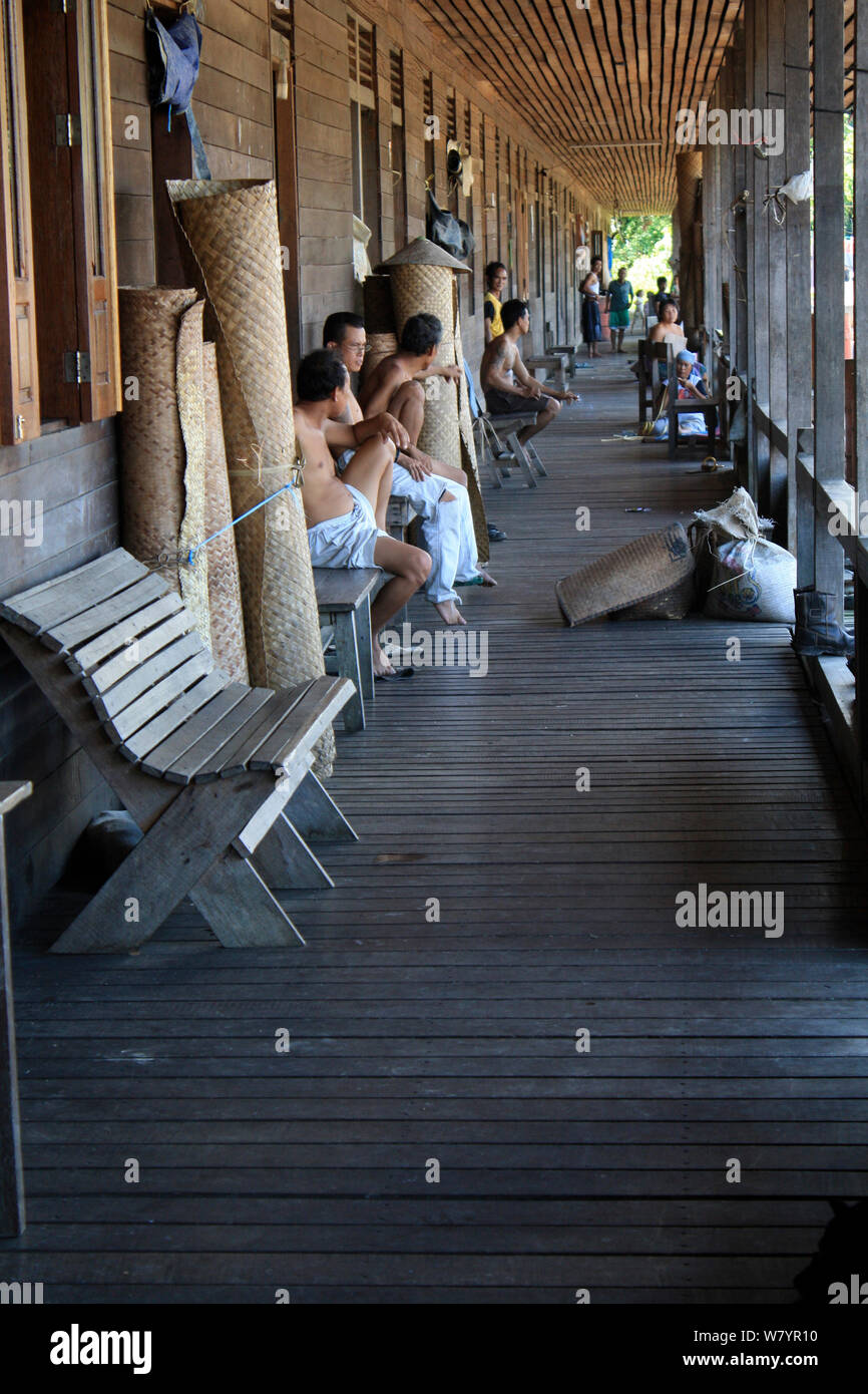 People in Dayak longhouse, West Kalimantan, Indoneisan Borneo. June 2010. Stock Photo