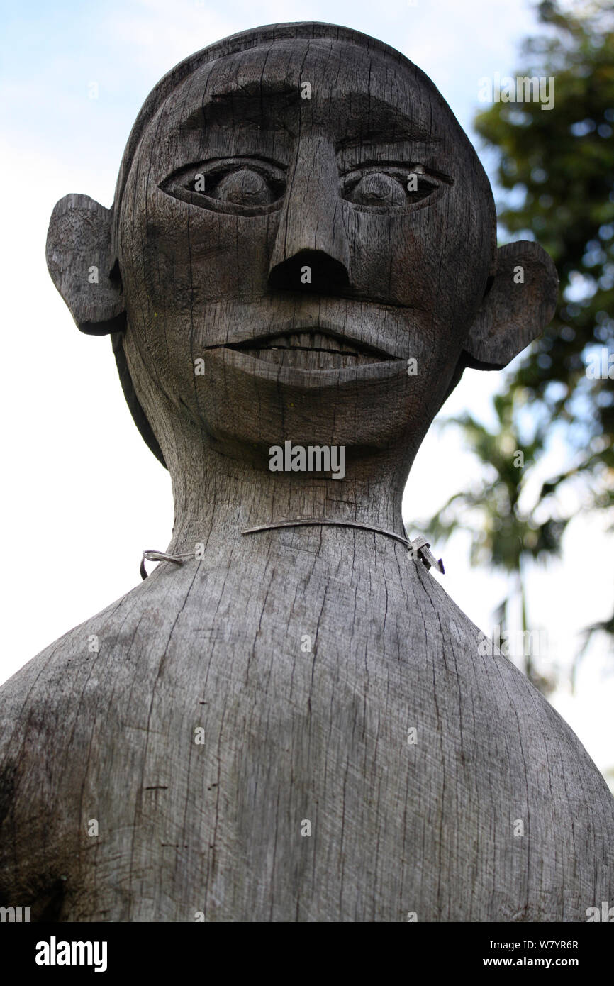 Ancestral figure carving in village, Southern Kalimantan, Indonesian Borneo. August 2010. Stock Photo