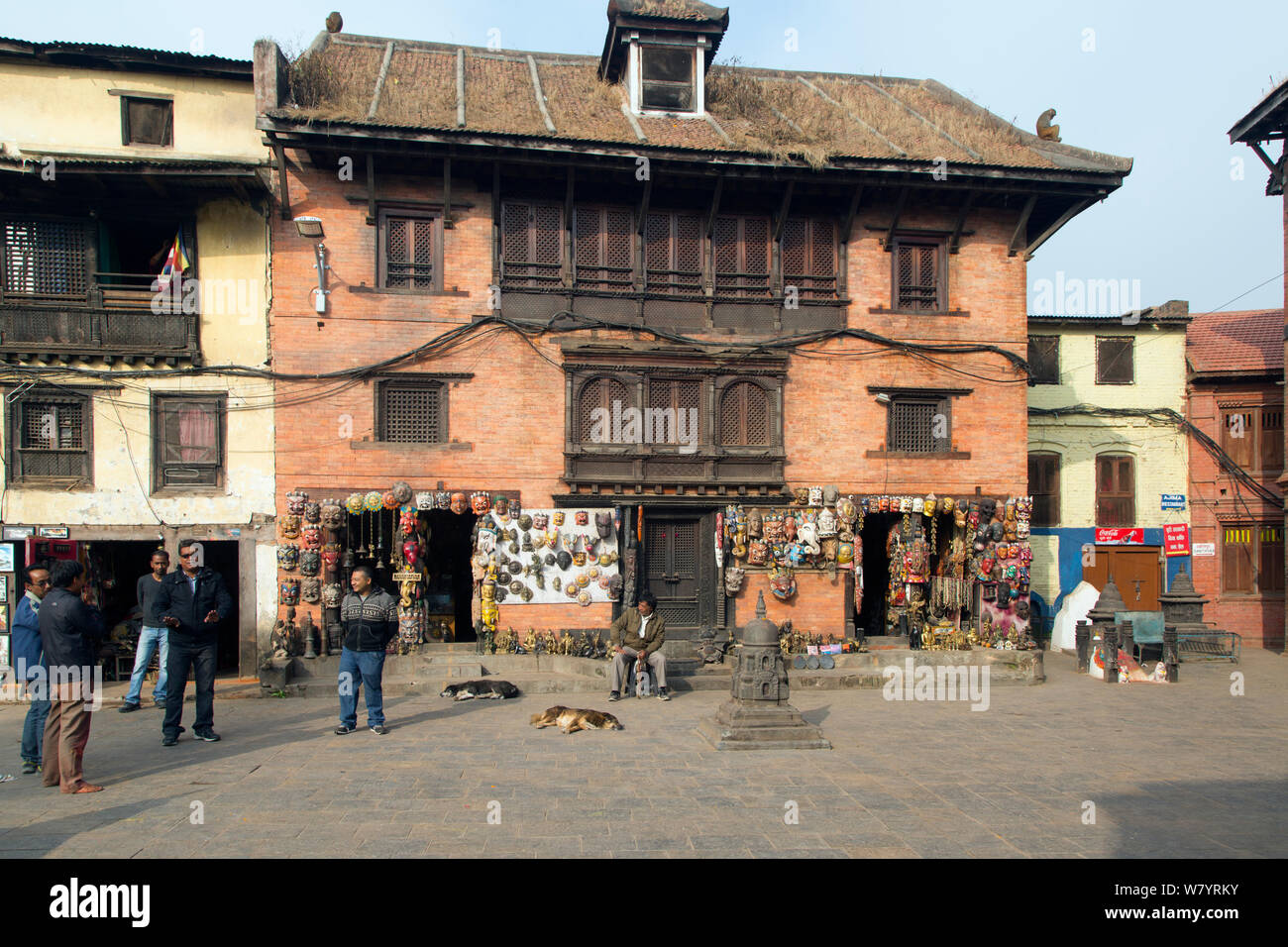 Historic buildings and shops selling masks, at the Monkey Temple or Swayambhunath, Kathmandu, Nepal. November 2014. Stock Photo