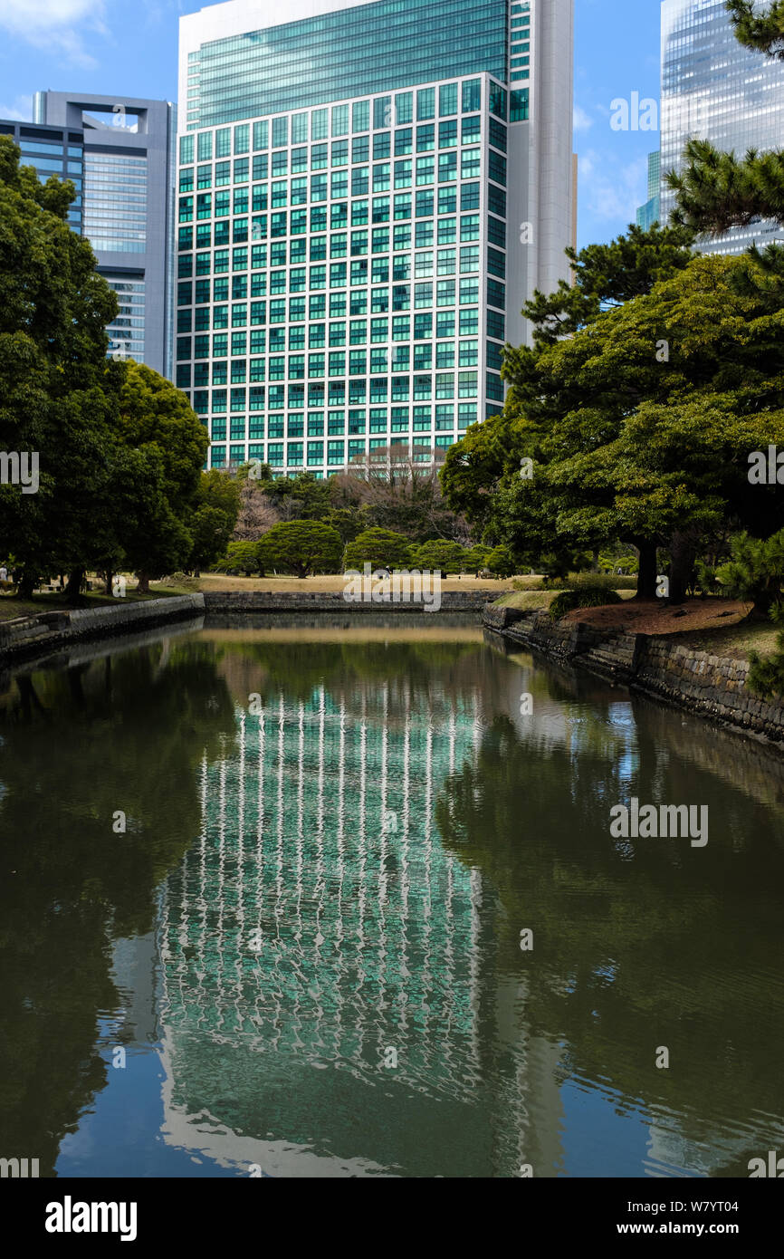 Reflection of a building in Hama Rikyu gardens in Tokyo Stock Photo