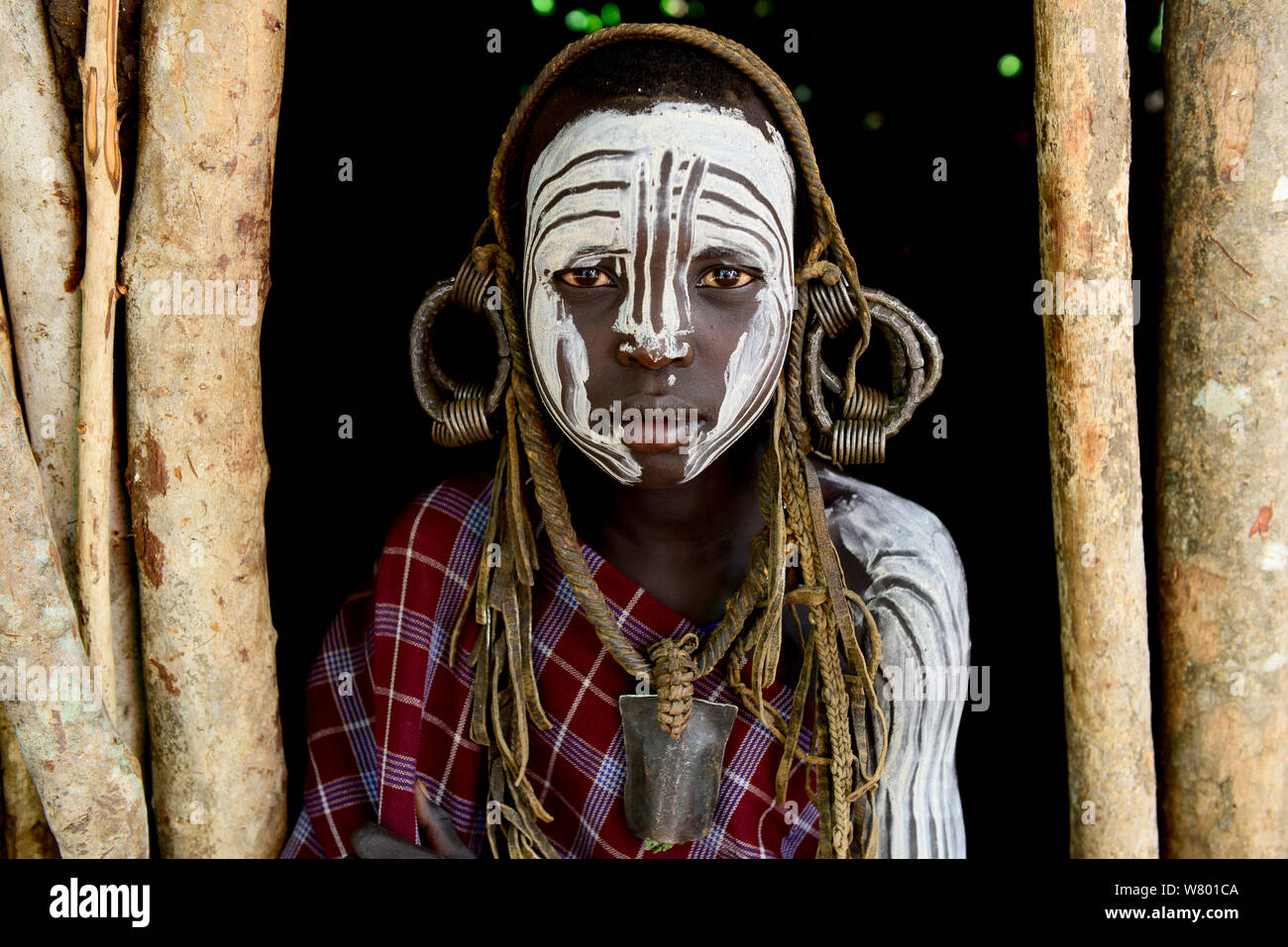 Girl with traditional clothes and ornaments. Mursi Tribe, Mago National Park. Ethiopia, November 2014 Stock Photo